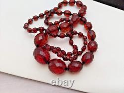 An Antique Graduated And Faceted Cherry Amber Bakelite Necklace Hand Knotting