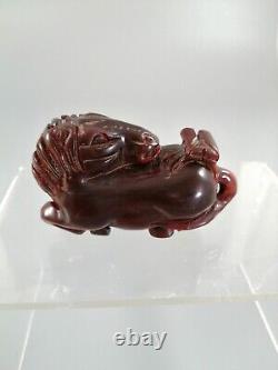 Antique Chinese or Japanese horse carved out of fine cherry amber
