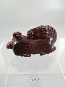 Antique Chinese or Japanese horse carved out of fine cherry amber