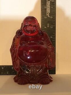 Chinese (Macao) Carved Red Cherry Amber Buddha Figure