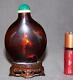 Rare 18th Century Chinese Red-amber Crizzled Glass Snuff Bottle With Wood Stand