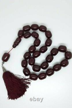 293 Gr Antique Faturan Cherry Amber Bakelite Rosary Prayer Beads Marbled can be translated to French as: 
293 Gr Ancien chapelet de prière en ambre de cerisier Faturan Bakélite marbrée