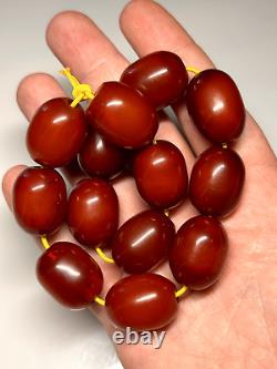 67 grammes de perles en ambre de cerisier Faturan antique en Bakélite marbrée