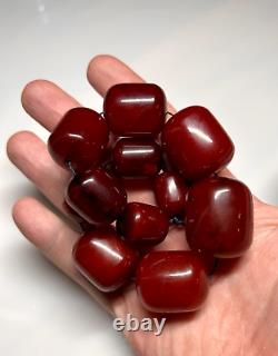 Collier de perles en ambre de cerisier ancien Faturan de 99 grammes marbré en bakélite.