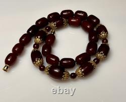 Collier de perles en ambre de cerisier faturan antique de 74,5 grammes avec marbrures en bakélite