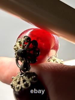 Collier de perles en bakélite d'ambre de cerisier Faturan antique marbré.