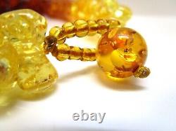 Collier en ambre ancien dégradé en forme d'haltère, perles d'ambre couleur miel doré cerise bleu