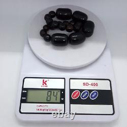 Collier incomplet en ambre de cerise noire antique en faturan de catalin bakélite de 83 grammes.