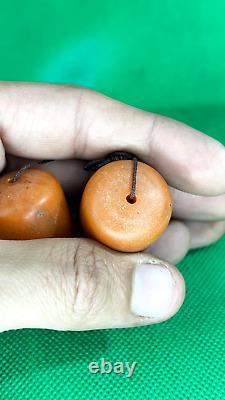 Énormes perles en bakélite de cerise ambrée antique de 35g, marbrées et tourbillonnées, très anciennes.