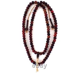 Perles de prière tibétaines anciennes en ambre de cerisier sculpté avec compteurs en bois.