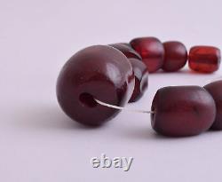 Perles en ambre cerise véritable et bakélite faturan antique