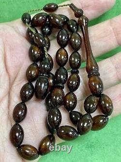 are et unique perle de prière islamique en ambre de cerisier faturan antique bakélite 33 perles 15 grammes.